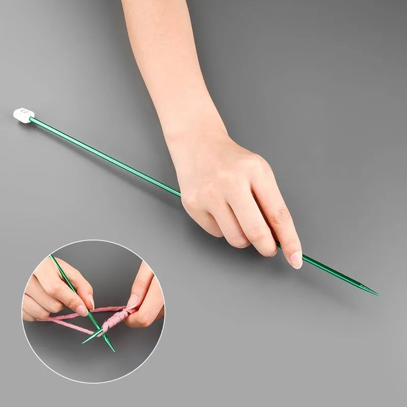 Complete set of aluminium crochet hooks in 14 sizes with protective caps laid out on a table.