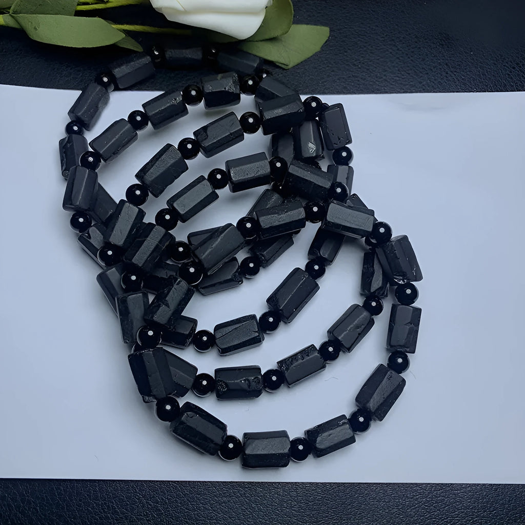 Natural black tourmaline rough stone bracelet with unpolished beads on wrist