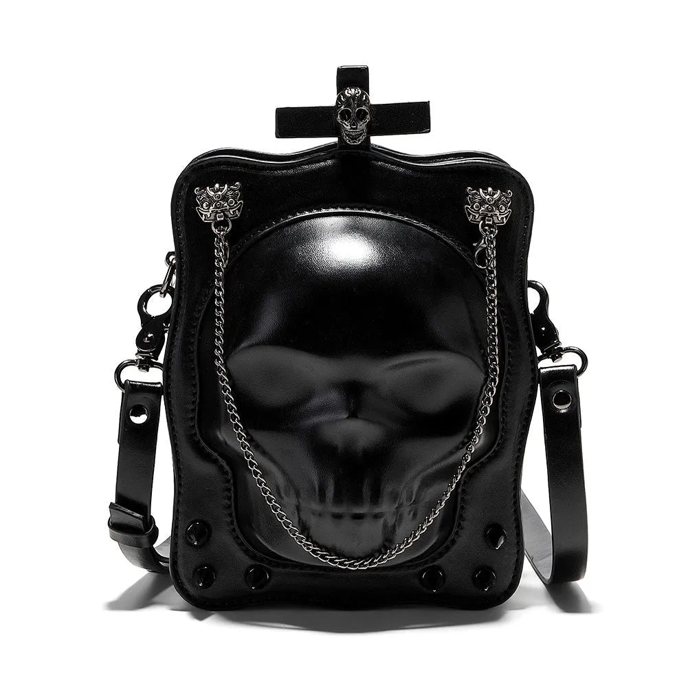 Black gothic crossbody bag with embossed skull design, chain strap and square shape