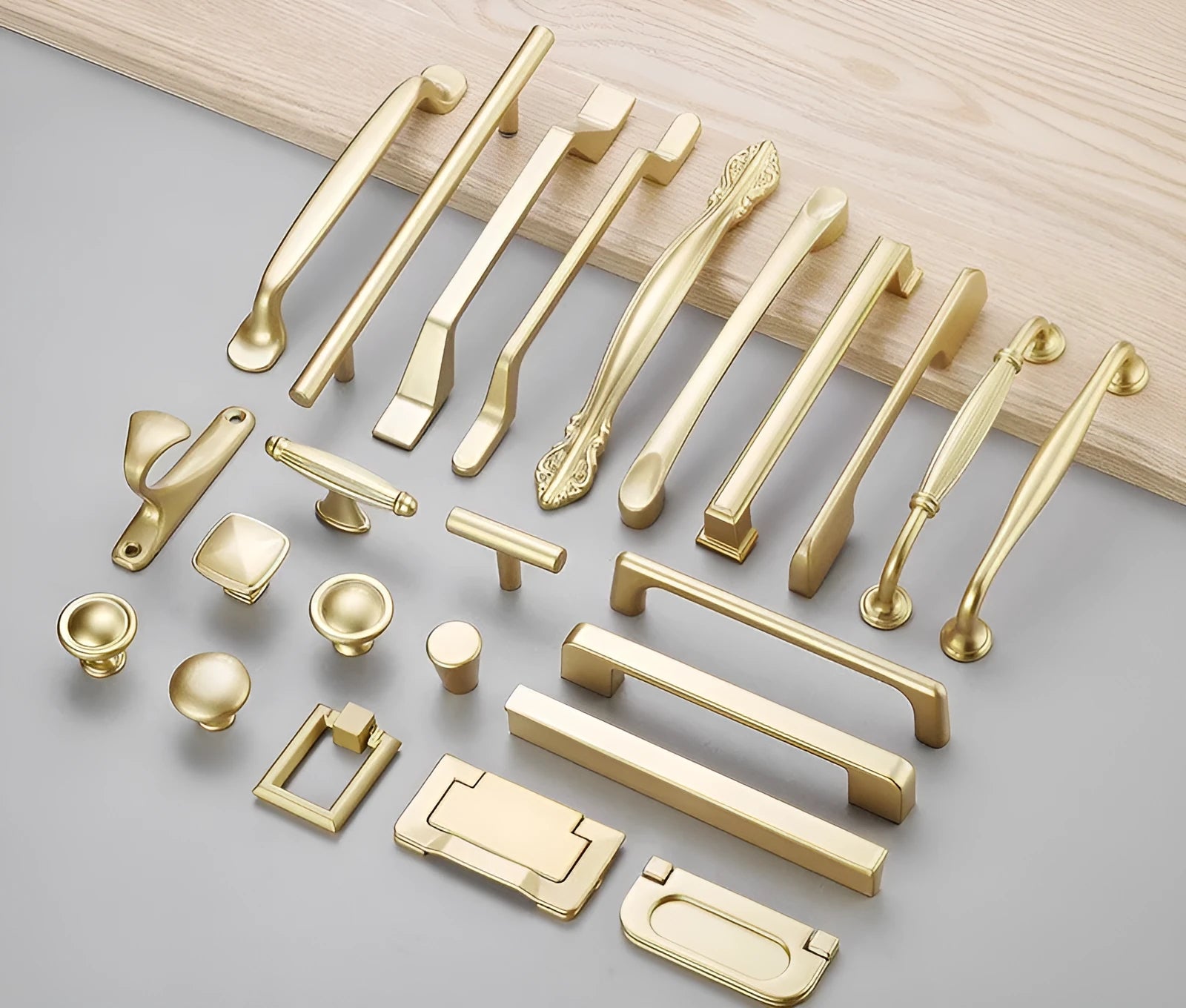 Gold T-shaped single hole cabinet handle with aluminium alloy construction.
