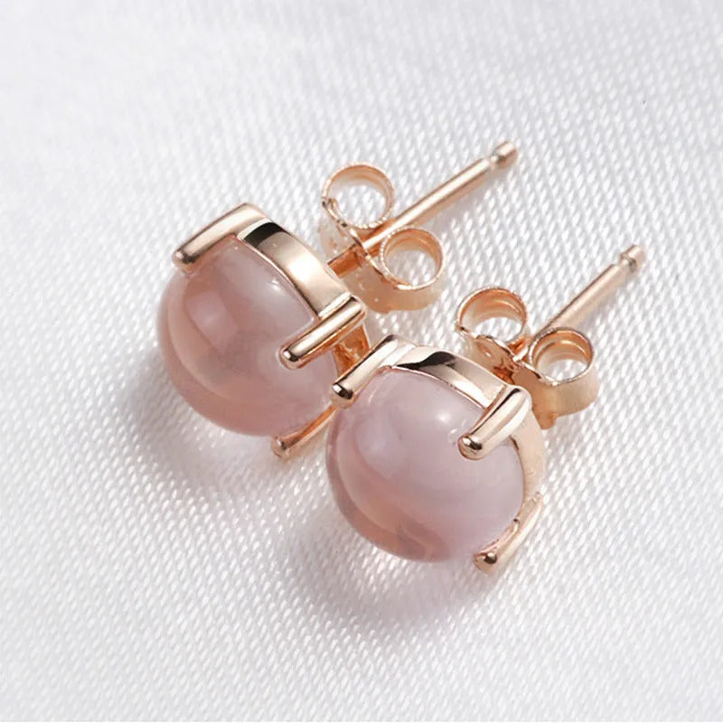 Women's rose gold Korean style stud earrings with synthetic ross quartz crystal inlay in drop shape