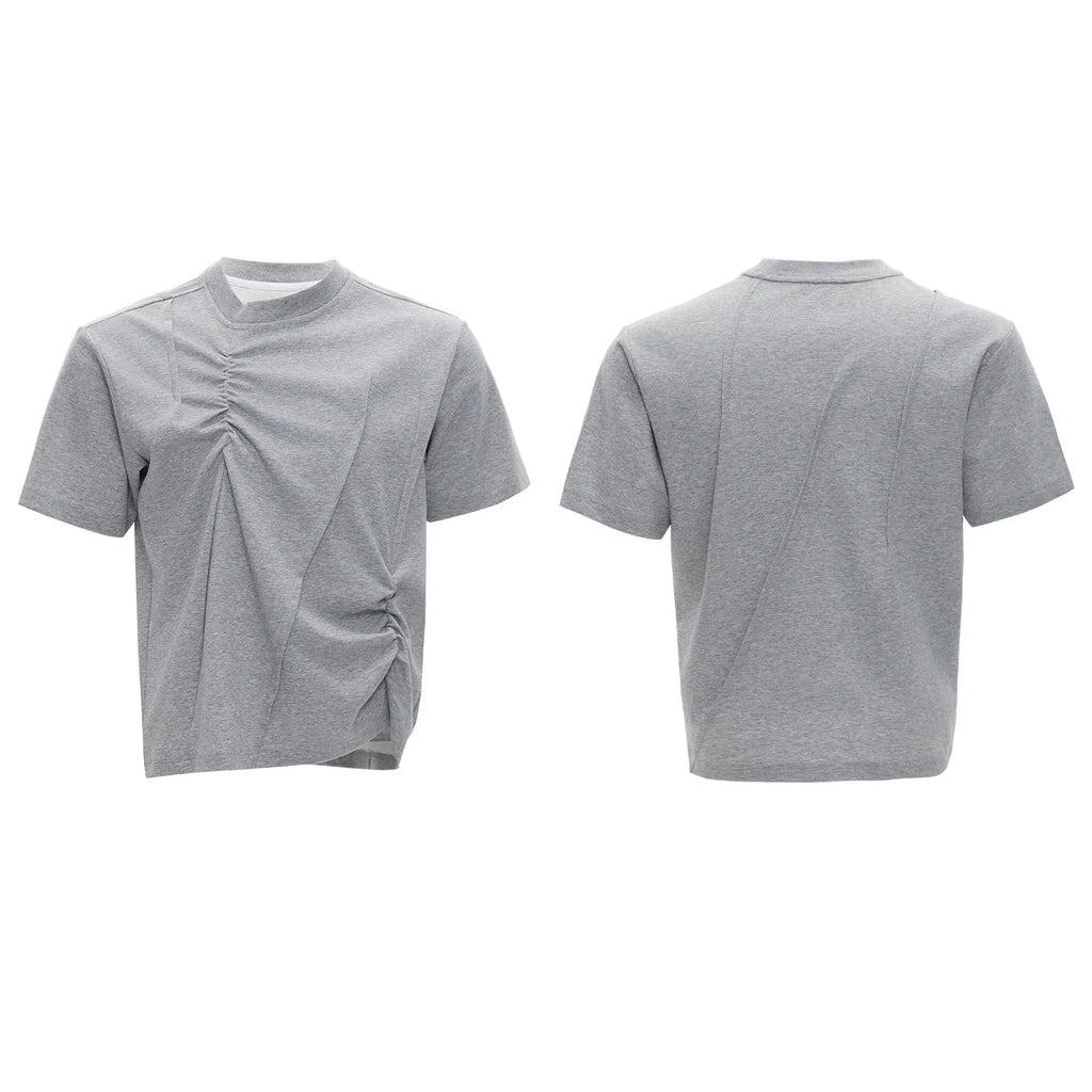Men's grey cotton T-shirt with loose fit, round neck, and three-dimensional pleated detail on the front.