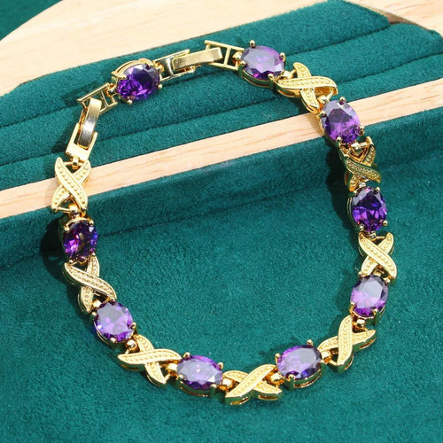 18k gold plated zircon jewellery set showing ring, earrings, bracelet and necklace in a coordinating colour.