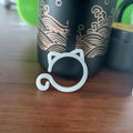 Cat-shaped plastic plant clip in green colour with dimensions 3cm wide by 4cm tall