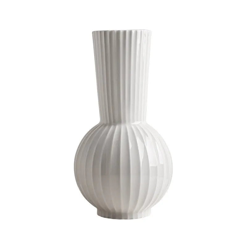 American country style ceramic vase with white base and blue stripes on living room table
