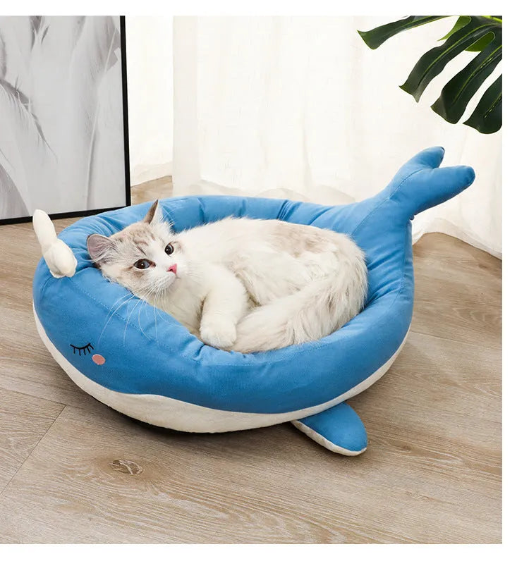 Blue duck-shaped fluffy pet bed sofa for small dogs and cats on a wooden floor.