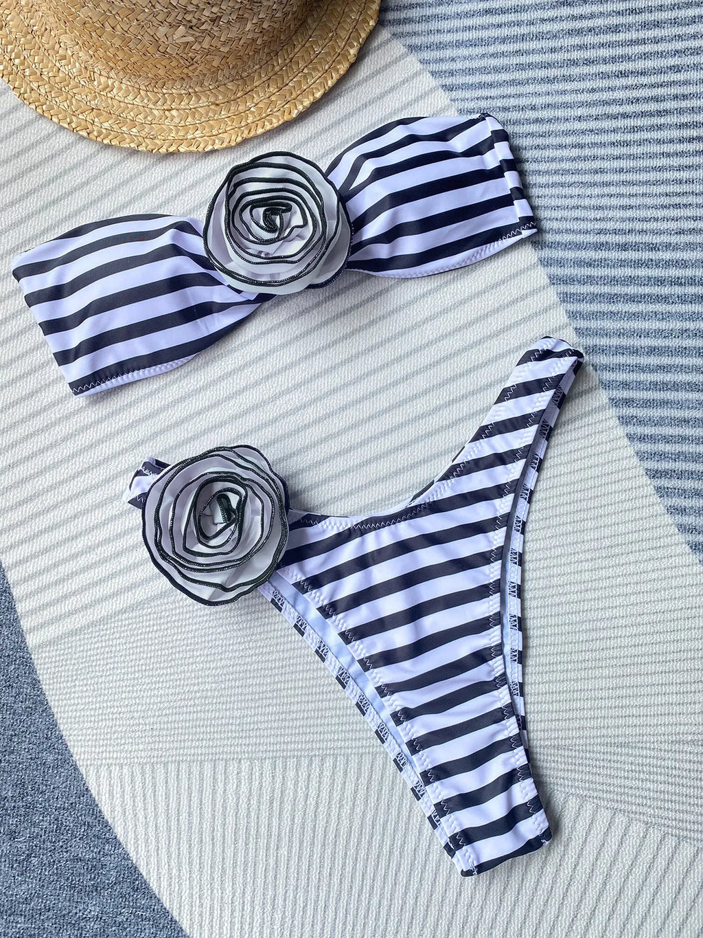 Women's black tube top bikini with a three-dimensional floral split design on the shorts.