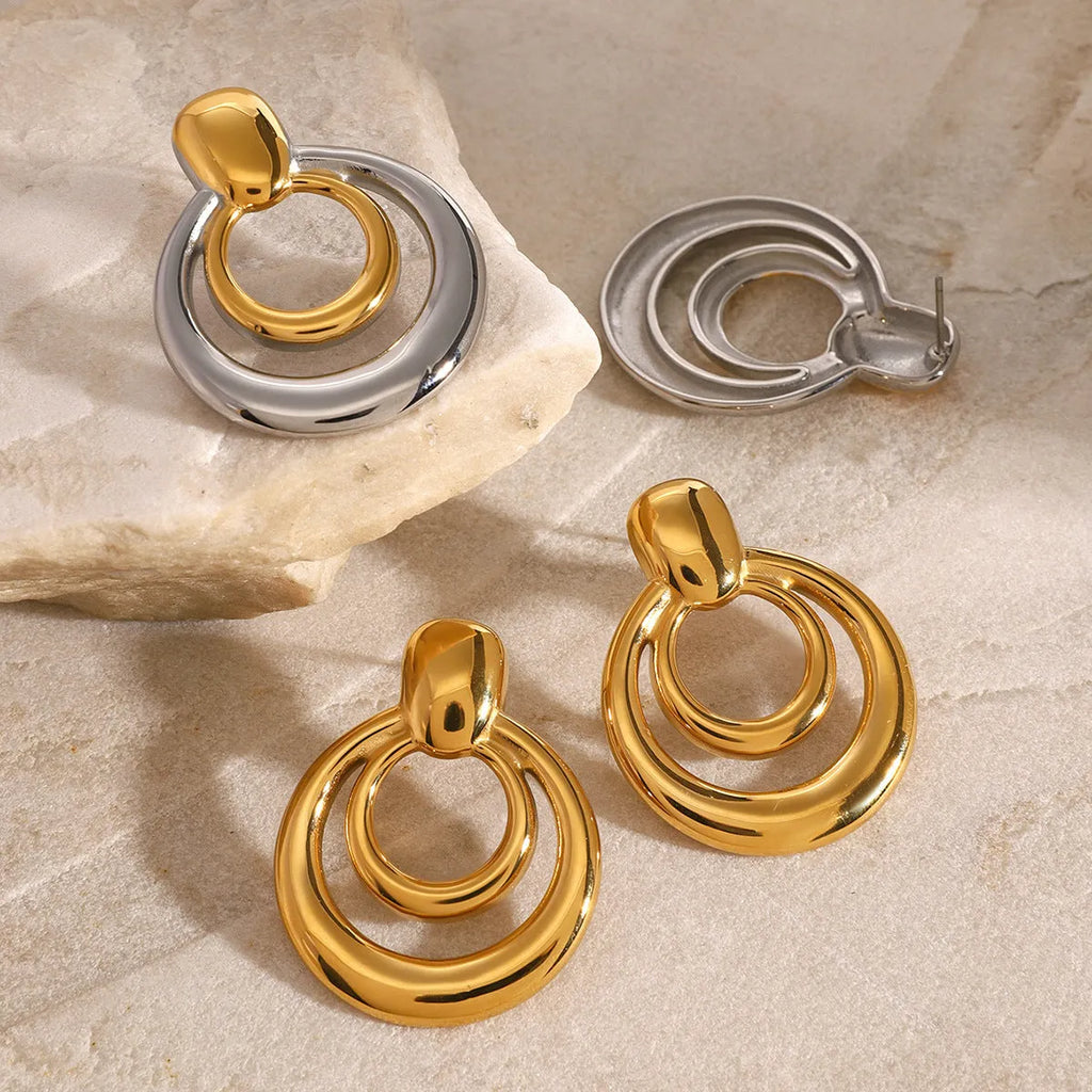 Gold round geometric stud earrings with double layer hollow construction and 18K gold electroplated finish