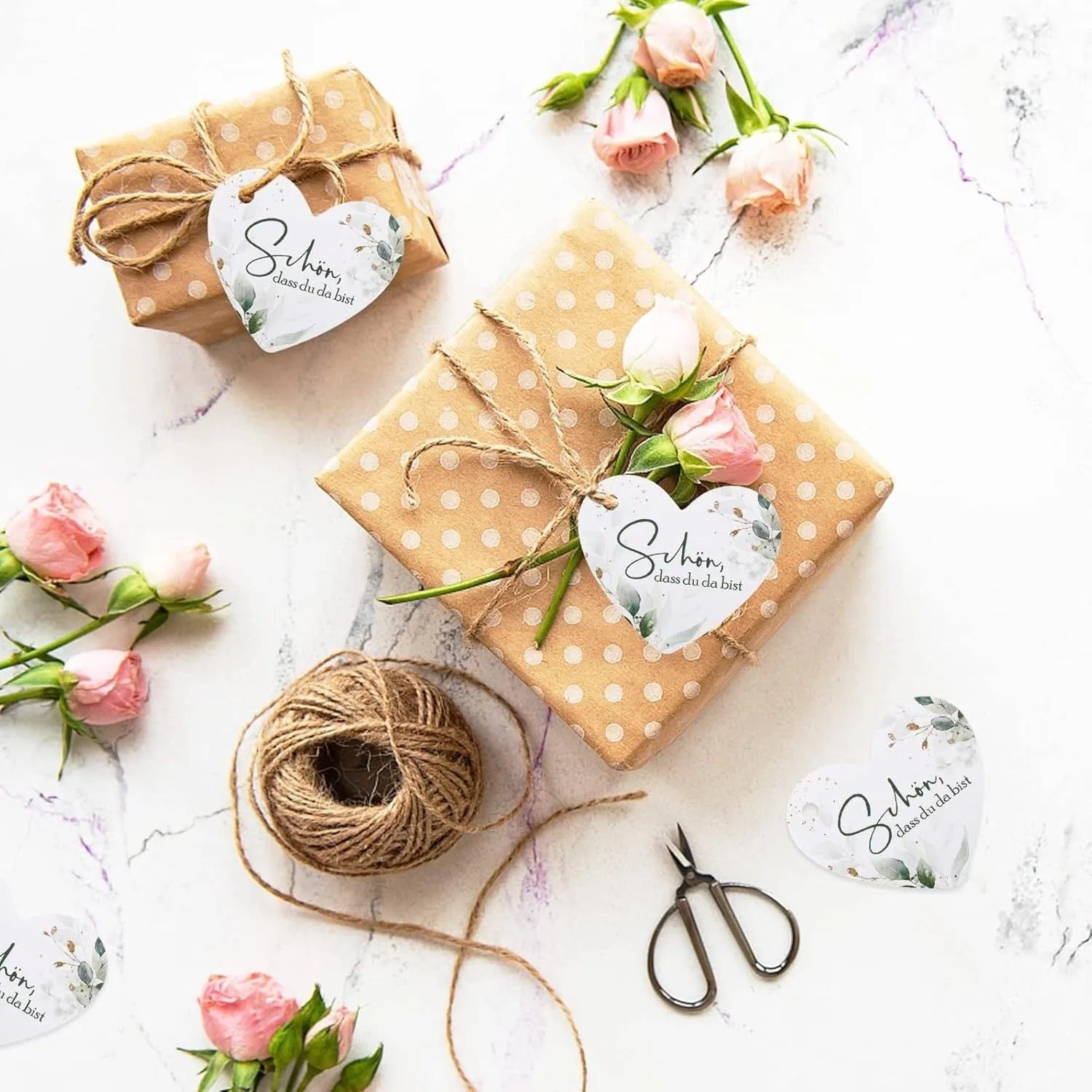 Set of 50 flower heart-shaped paper gift tags in two colour styles, showing half-handmade craft detail.