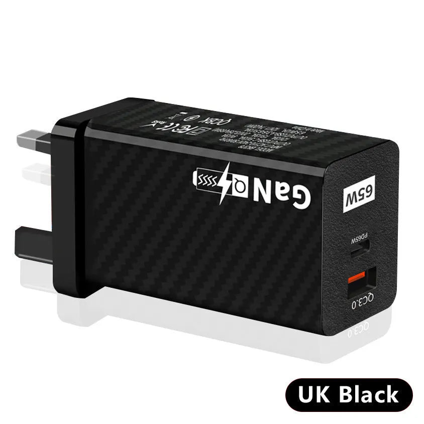 White and black 65W GaN laptop charger with USB-C port, shown next to EU and US plug options for scale.