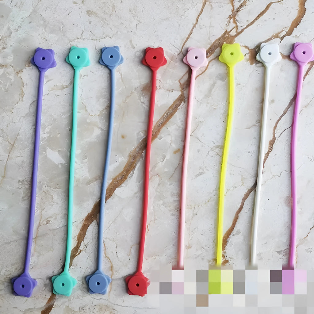 Star-shaped silicone magnet wire winder organiser for headphone and computer cables in multiple colours