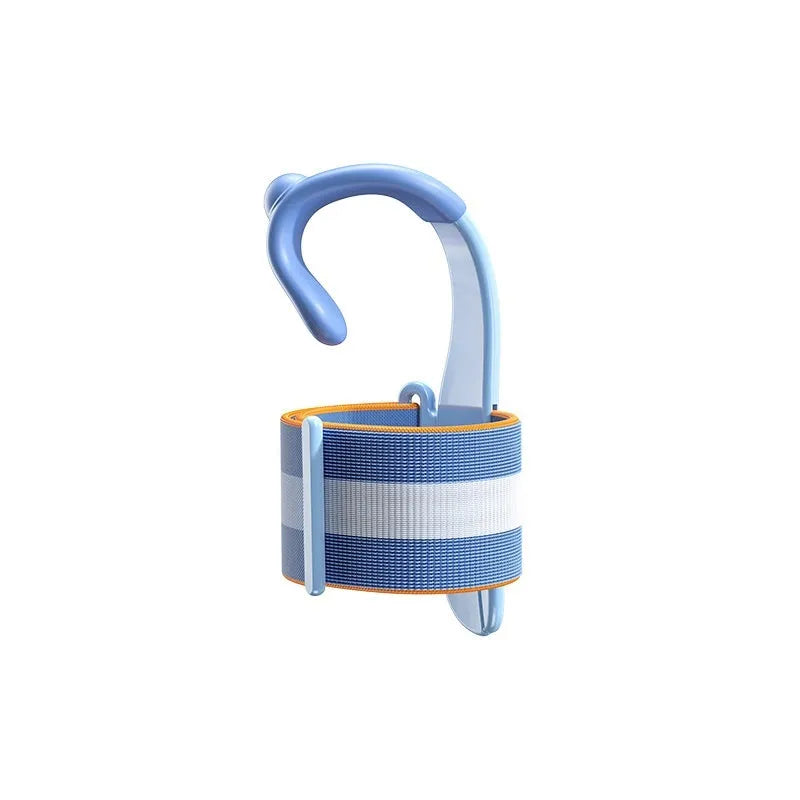 Blue anti-hook wrist brace pen corrector for children's handwriting posture on a desk.