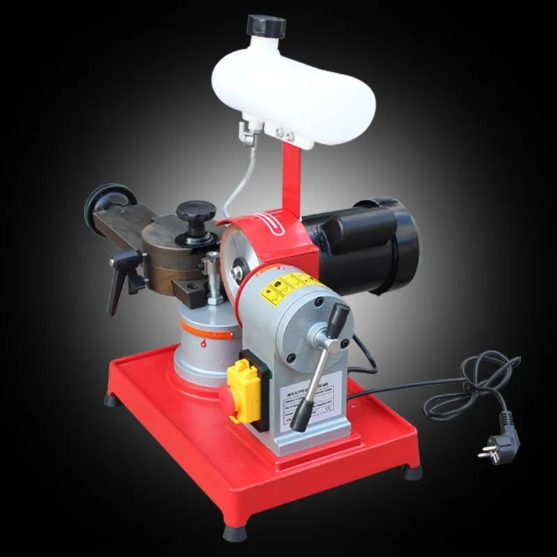Manual sharpedge grinding machine for woodworking saw blades on a workshop bench.