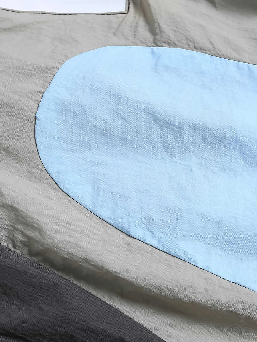 Blue patchwork quick-drying men's shorts with loose straight-leg fit and elasticated waist.