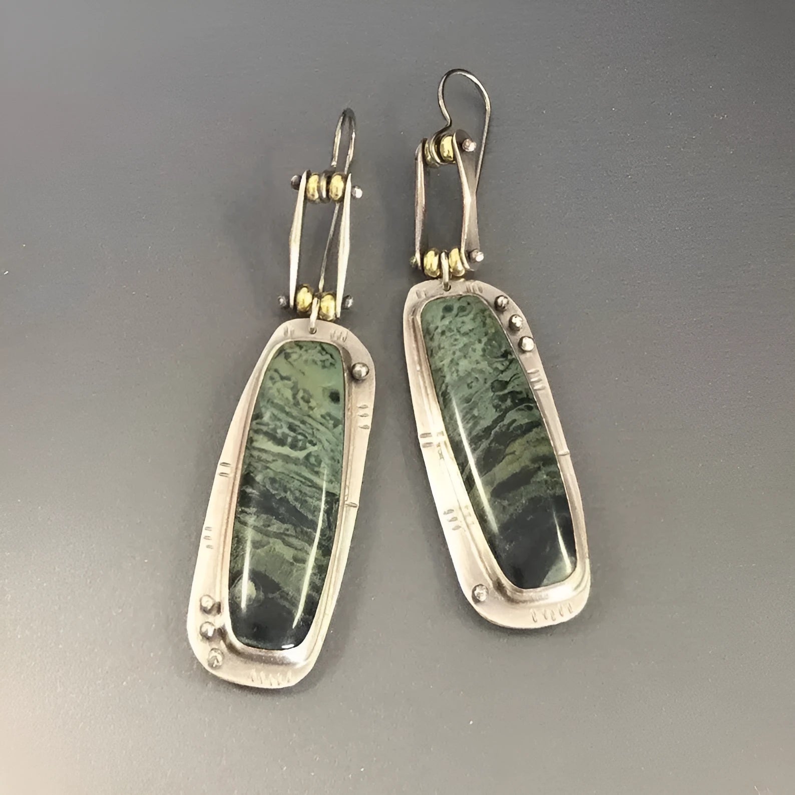 Women's geometric drop earrings with a two-colour marble pattern on alloy metal.
