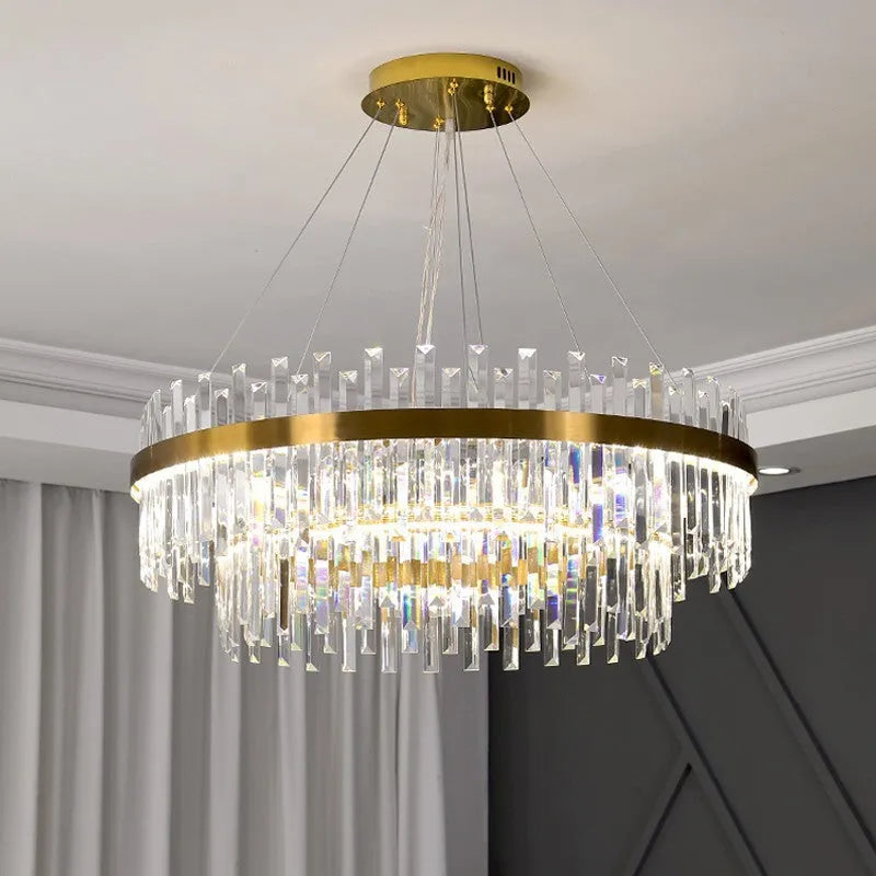 Stainless steel and crystal multi-head chandelier light with adjustable height for ceiling.