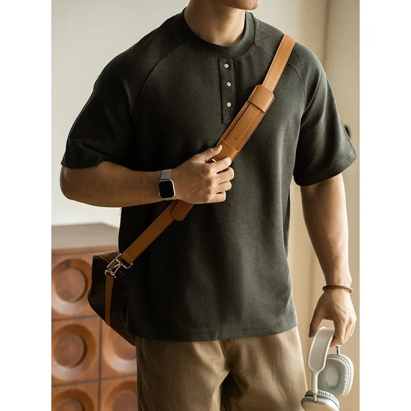 Casual loose-fitting pullover top with raglan sleeves in terry texture fabric shown in smoky grey colour