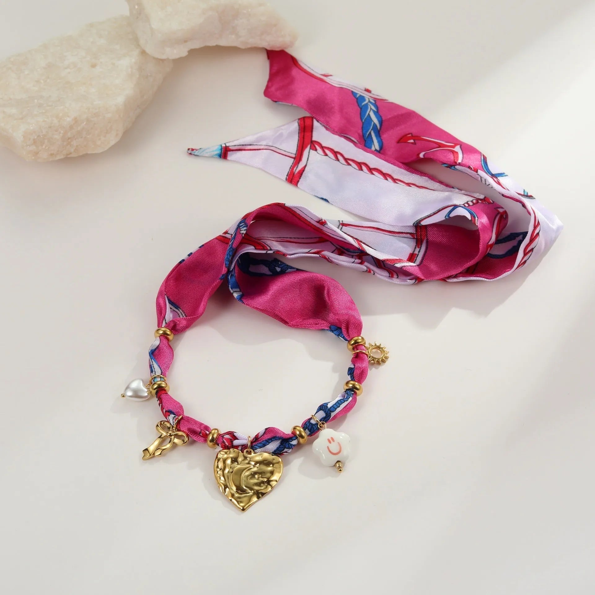 Stainless steel necklace and bracelet set with geometric love pendant designs in 18K gold plating