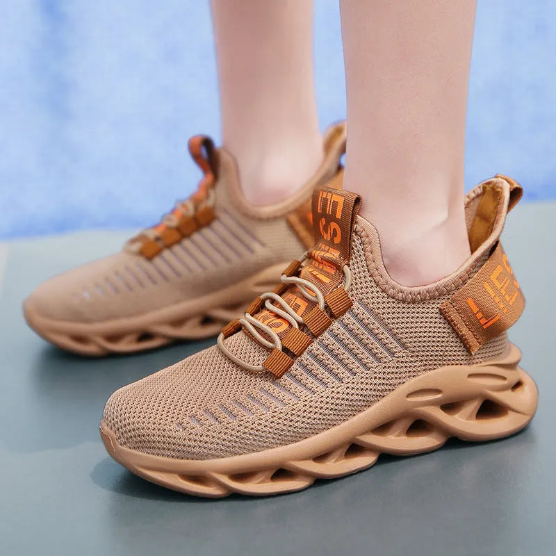 Children's casual sneakers with Velcro fastening in fabric and EVA, shown in black, khaki, and white colour options.