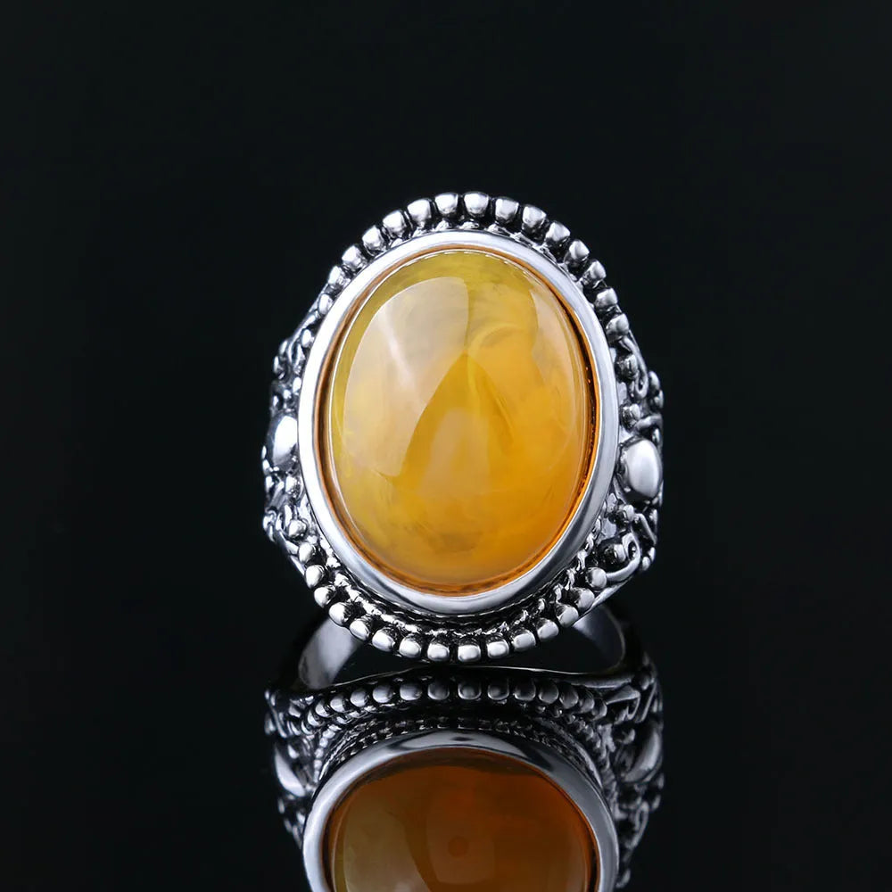 Geometric retro ring in antique silver amber colour with alloy electroplated construction
