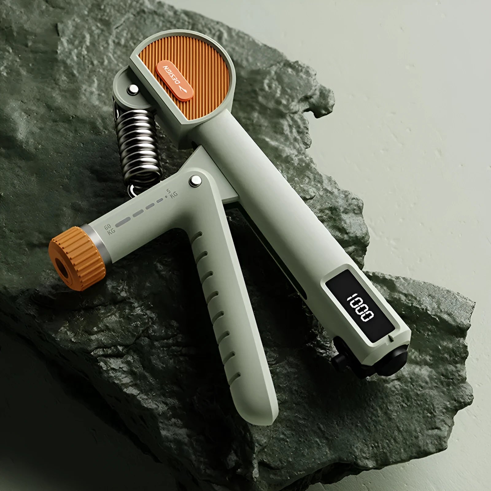 Adjustable spring hand grip strengthener in ABS plastic, shown in three colour options