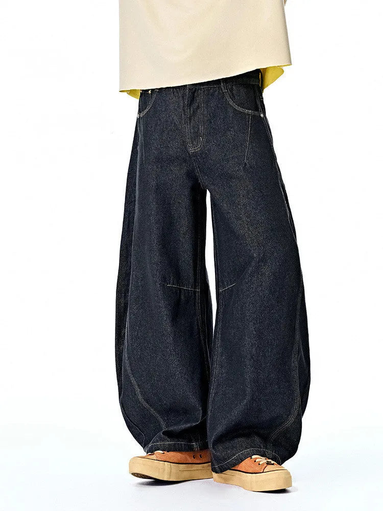 Men's wide leg denim trousers in original cow colour showing mid-waist design and cotton denim fabric
