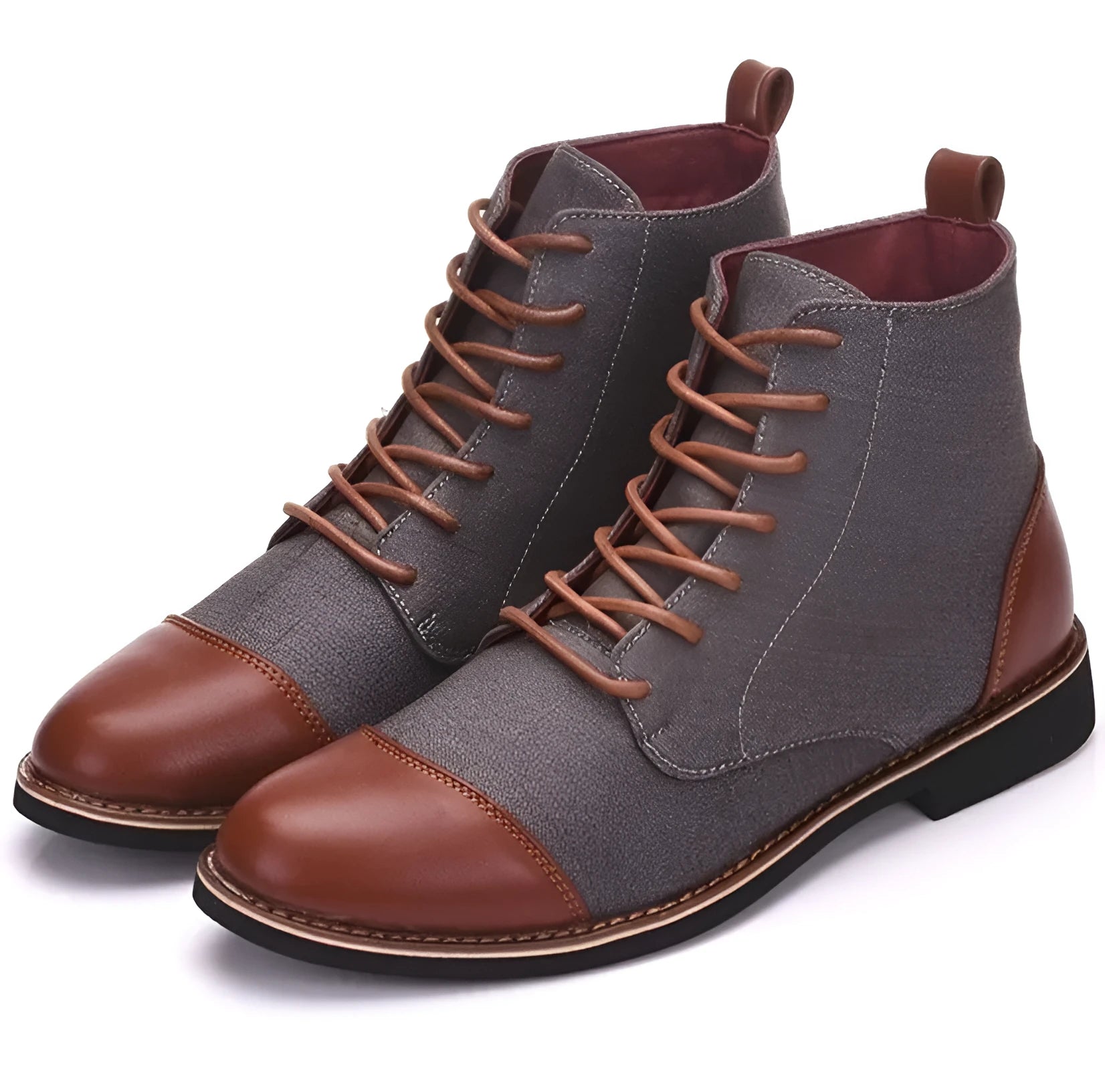 A pair of large black leather motorcycle-style boots with visible belt buckles and a rubber sole.
