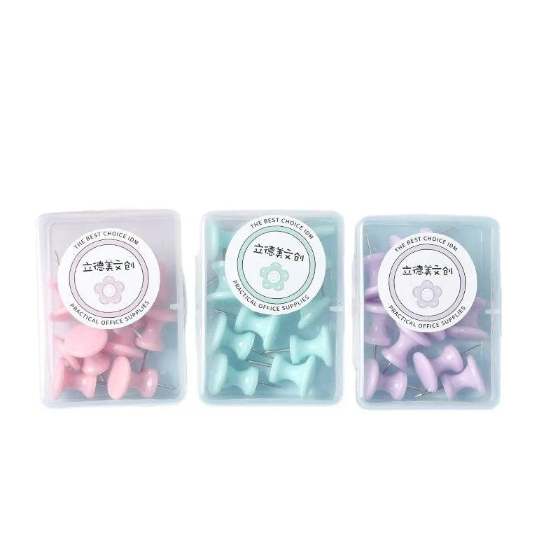Box of plastic push pins in large and small sizes showing cherry blossom pink, mint green, and lavender colours.