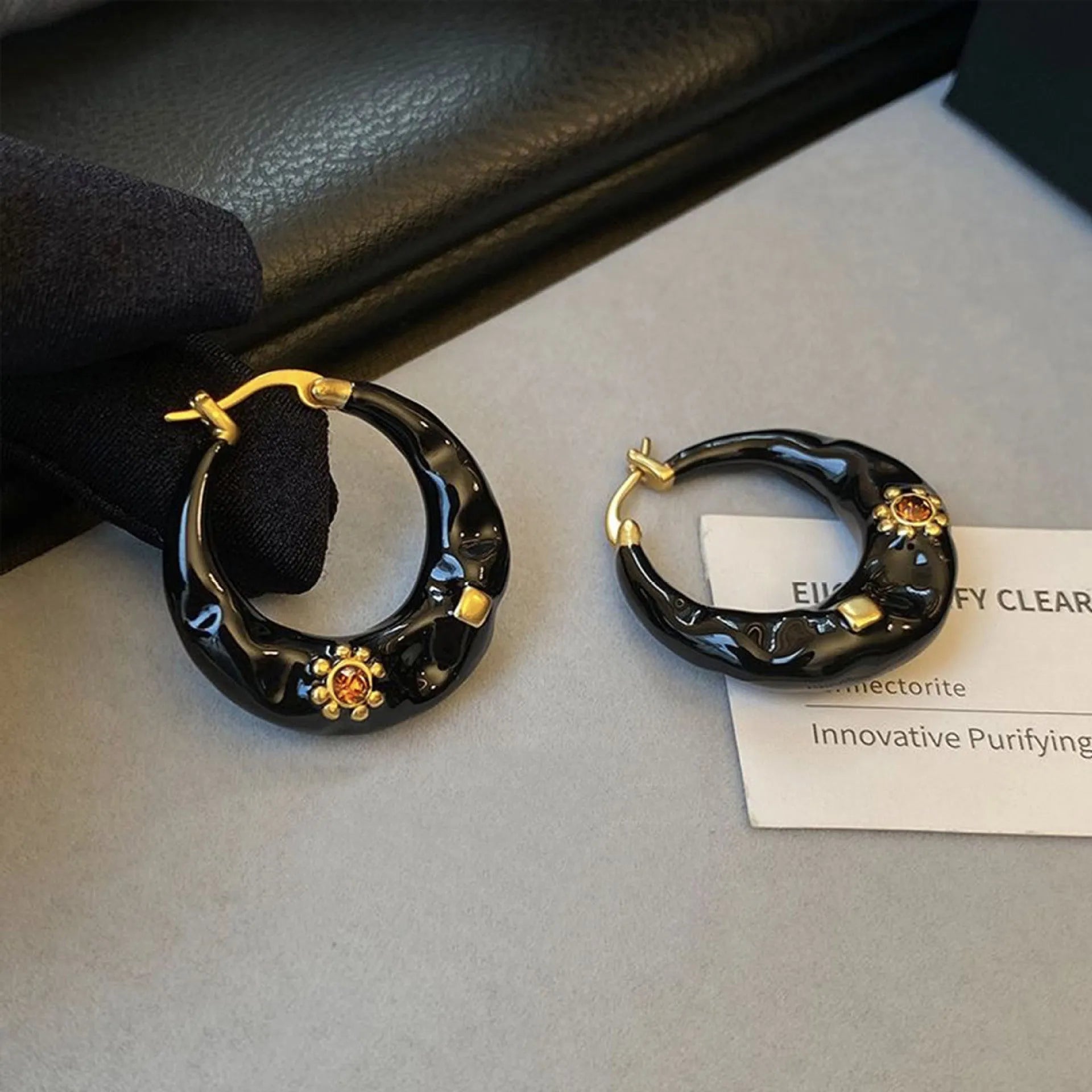 Hong Kong style retro ear studs with rhinestone detailing in black and red colour options