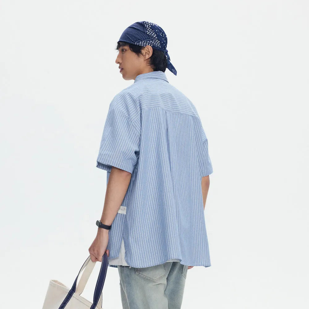 Blue striped short-sleeved overall shirt with cardigan style in cotton blend fabric