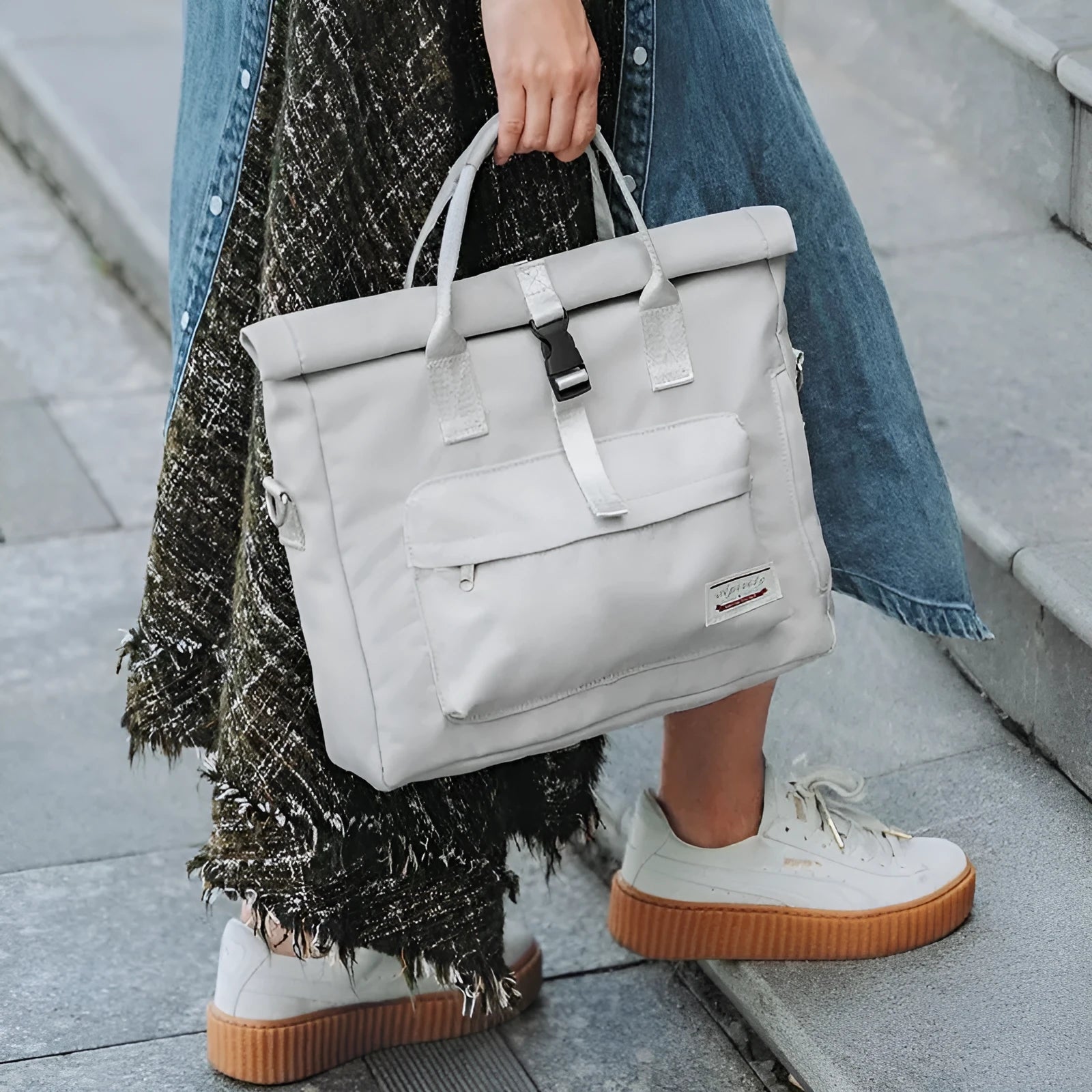 Shockproof inner liner laptop bag in waterproof nylon, shown in black, beige grey, or pink.