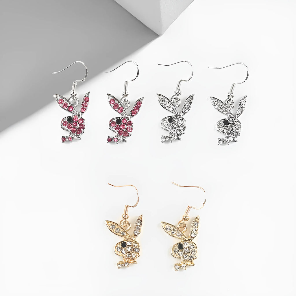 Rabbit stud earrings in silver pink gold colours with cartoon animal design and constellation details