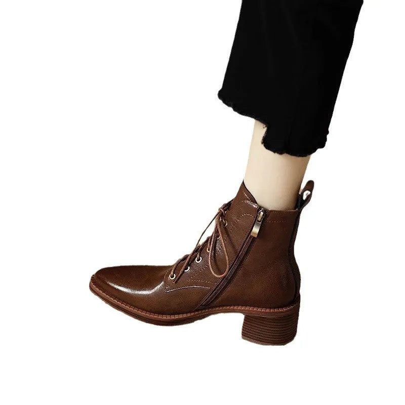 Women's black pointed-toe short tube boots with 5.5cm heel and artificial PU upper
