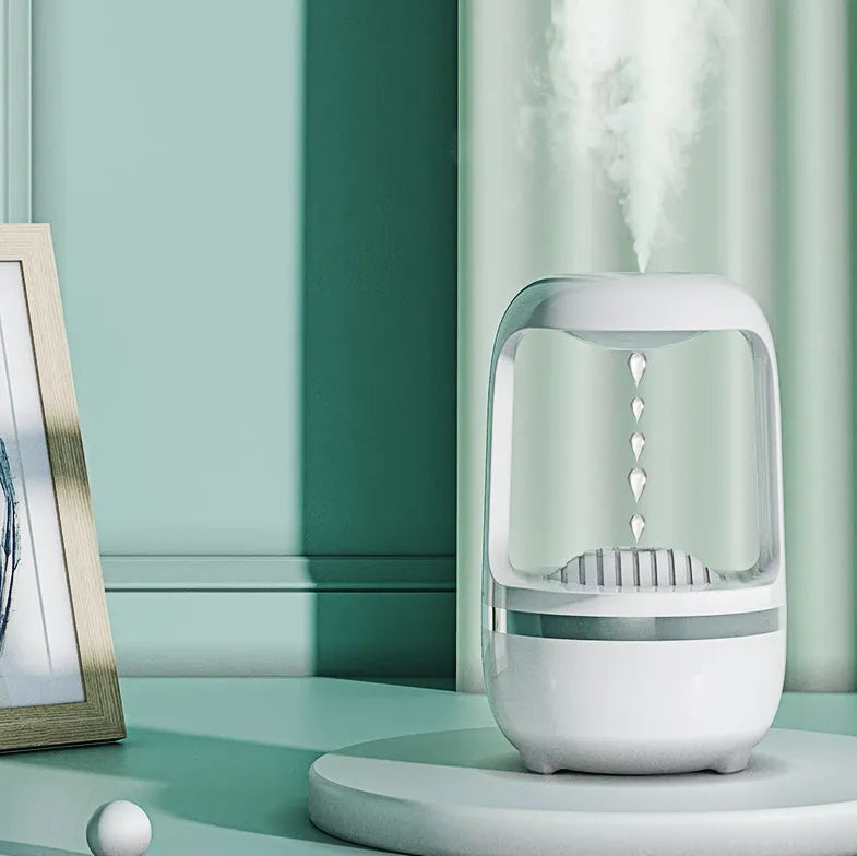 Black or white anti-gravity humidifier showing water droplet effect, with USB cable and 500ml water tank.