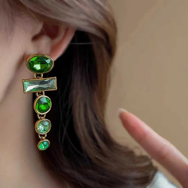 A pair of green gradient geometric alloy earrings with a tassel and inlaid zircon stones in a Chinese retro style.