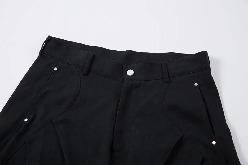 Men's black pleated machete casual pants with loose-fitting wide-leg styling in cotton fabric