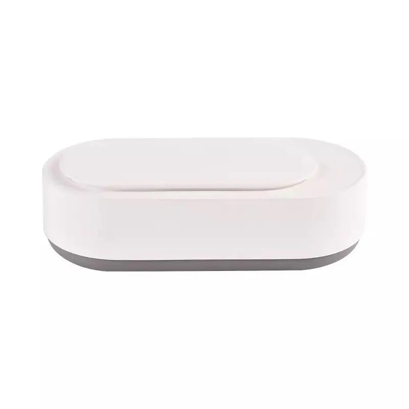 White portable ultrasonic cleaning machine with digital display and stainless steel tank.