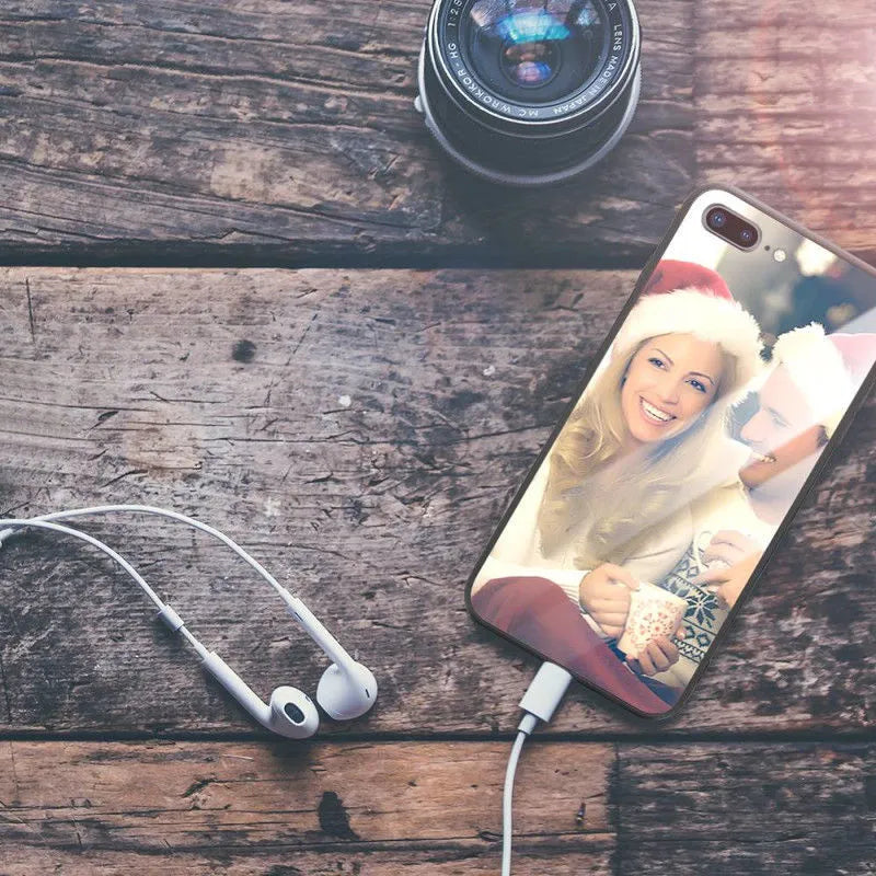 Slim hard back patterned case for iPhone with raised edge protecting camera and screen.