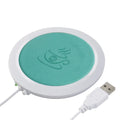 USB-powered insulated heating coaster for mugs in black, blue, and orange colour options.