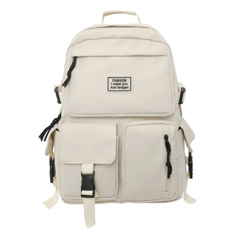 Black and white soft nylon student backpack with laptop compartment and external pockets.