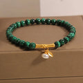 Women's white crystal bracelet with a raised lucky bamboo design centrepiece.