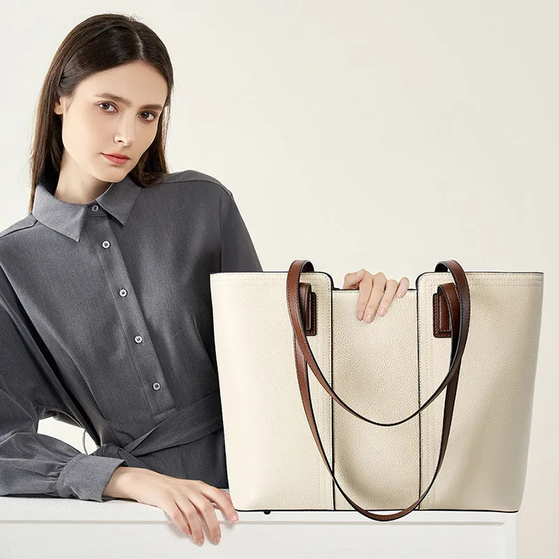 Women's black genuine leather crossbody commuter bag with square shape and multiple internal pockets.