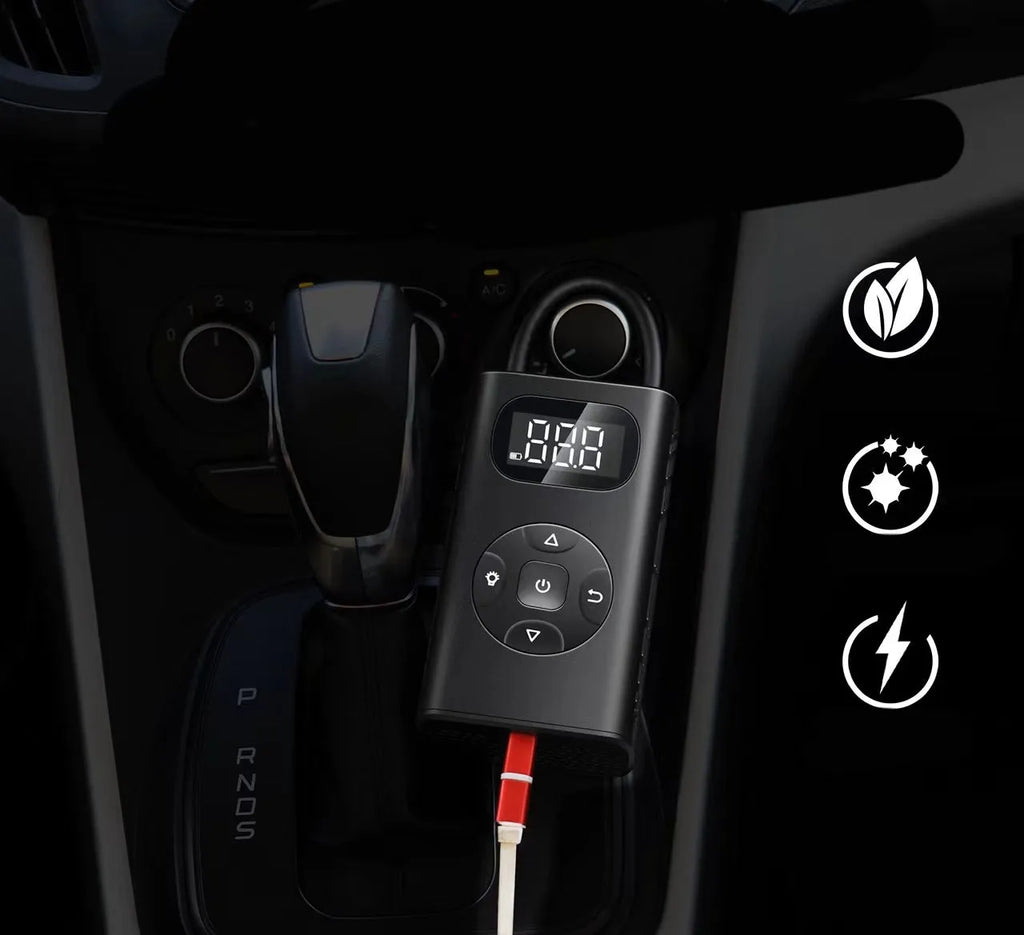 Black portable digital tyre inflator with power bank, USB cable, and 16cm tube on a grey background.