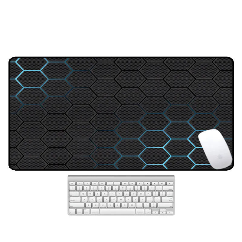 Large natural rubber non-slip mouse pad with decorative pattern on a desk.