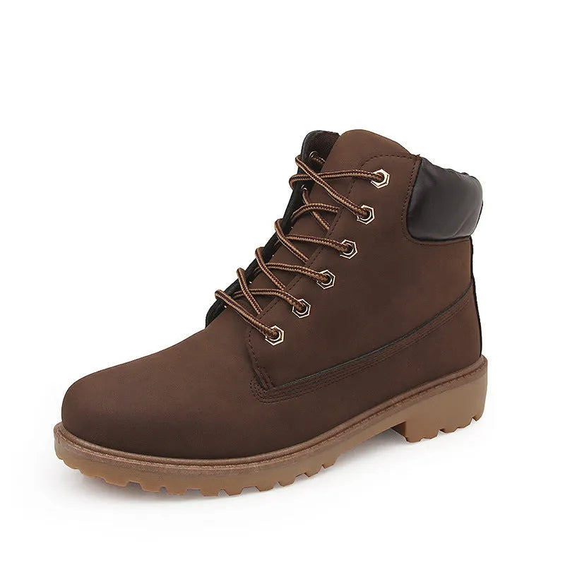 Men's pink high-top Martin boots with round toe and front lace-up on a flat bottom.