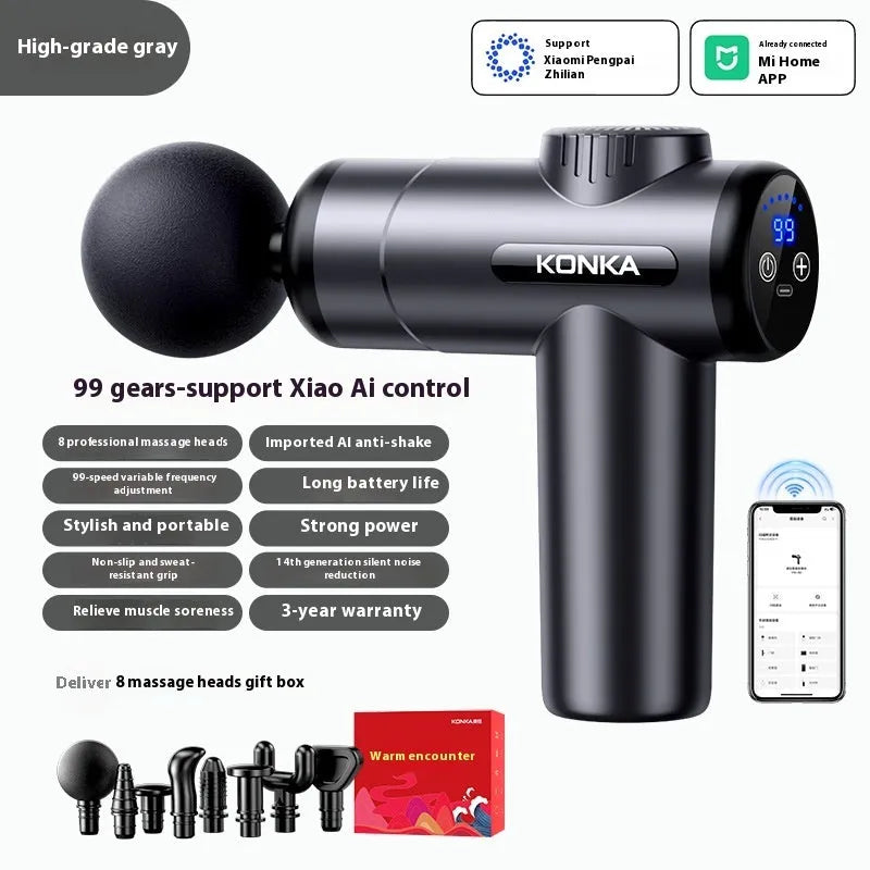Konka V19 mini electric massage gun in grey colour with multiple attachment heads on a table.