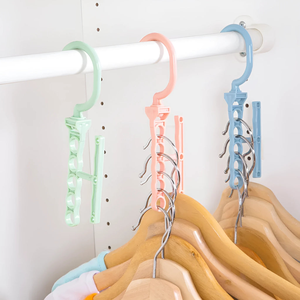 Blue revolving wardrobe hanger with five rotating arms and a handle for clothes organisation.