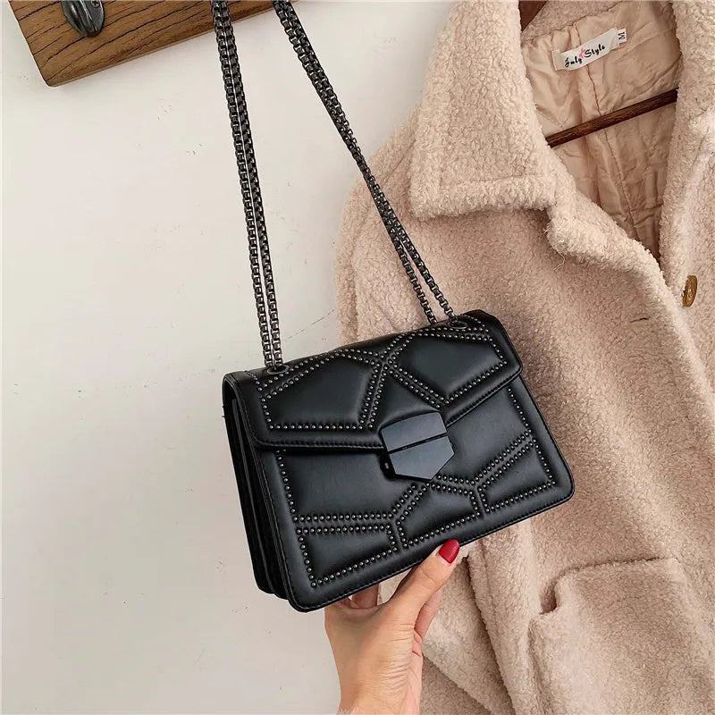 Small square PU shoulder bag with gold rivet studs, chain handle and zipper closure, available in four colours