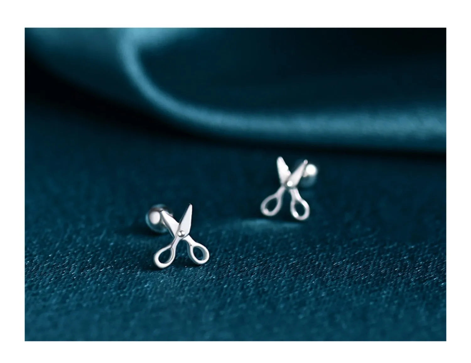 Sterling silver ear nail earrings with screw closure and miniature scissors charm.