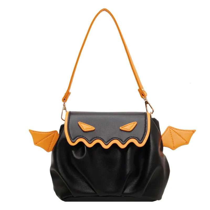 Orange PU crossbody bag with pumpkin cartoon shape and small wings, placed on a neutral background